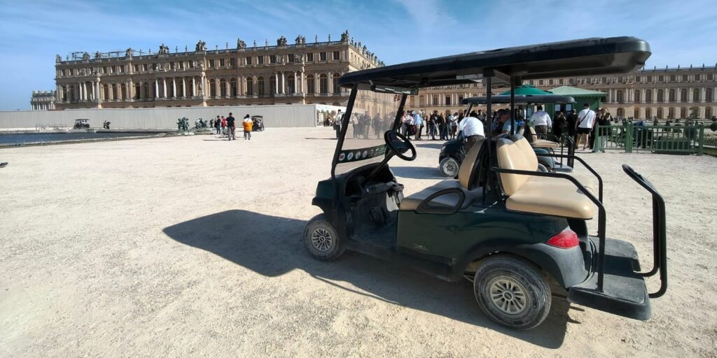Golf cart with Château in the background